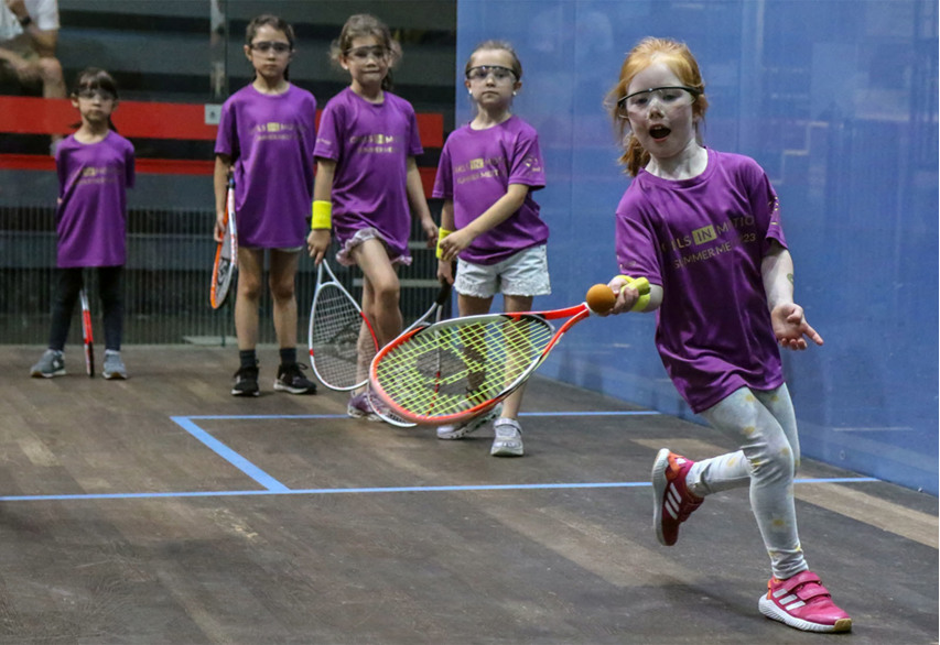 Young girls playing squash at the Squash Girls in Motion event